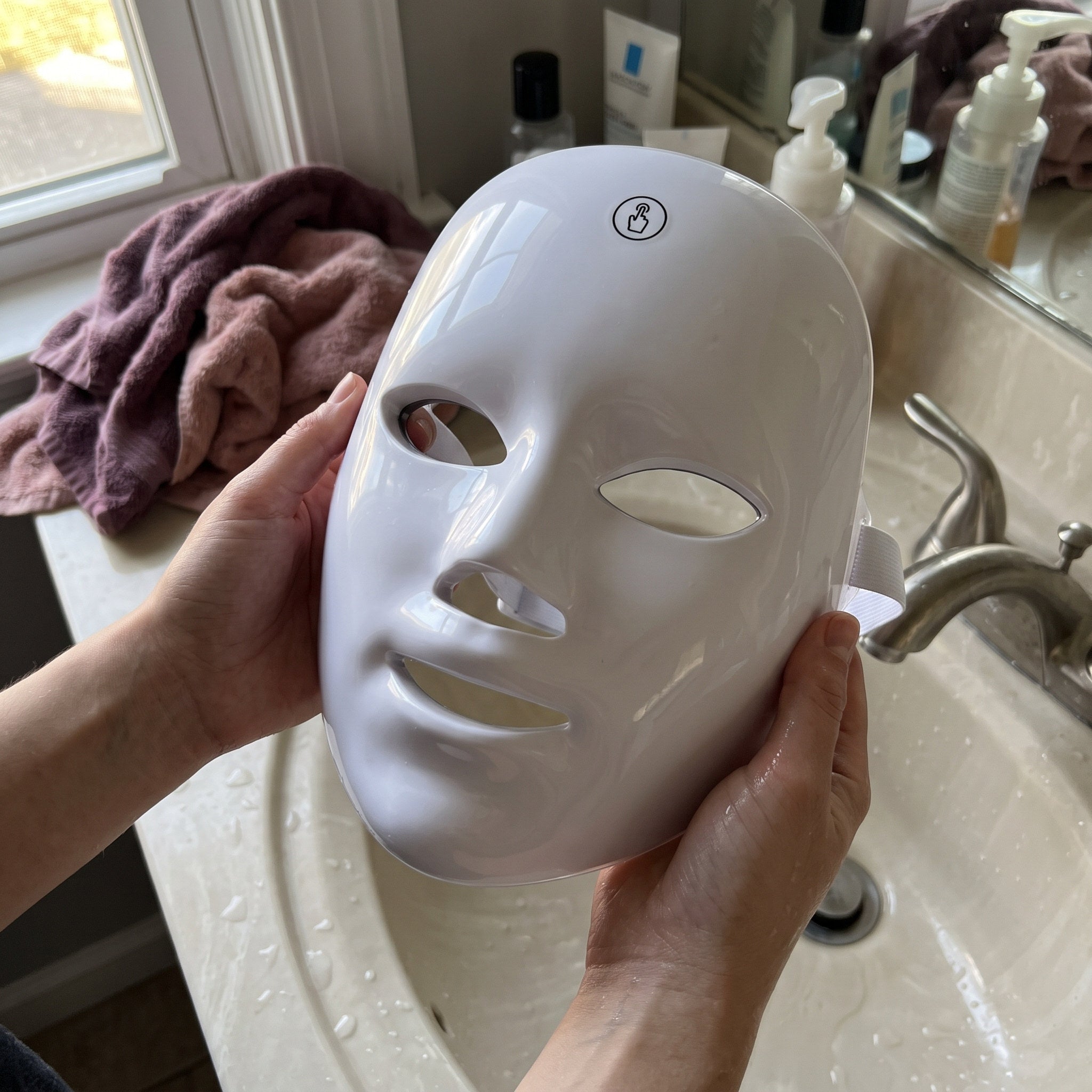 White Glow Hour LED face mask in an at-home self-care scene 1