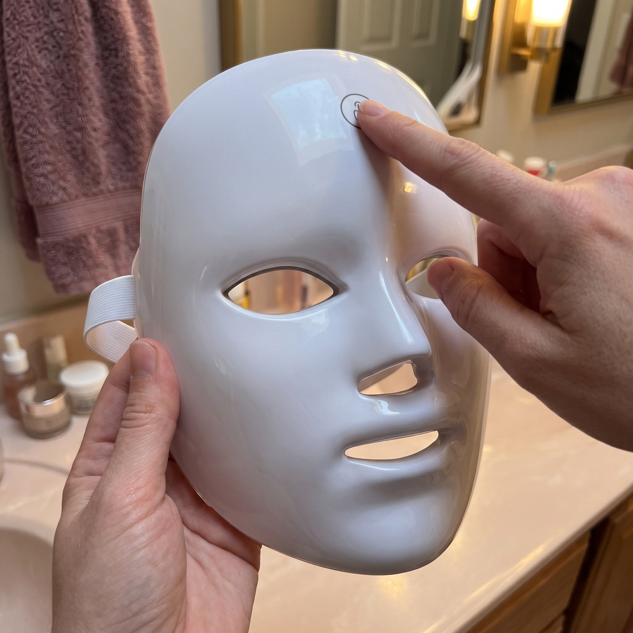 White Glow Hour LED face mask in an at-home self-care scene 6
